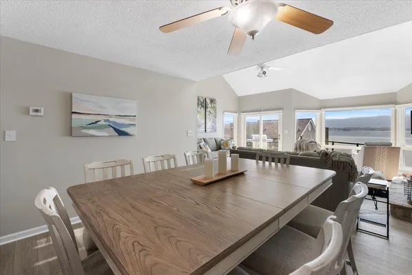 a living room with furniture and a ceiling fan