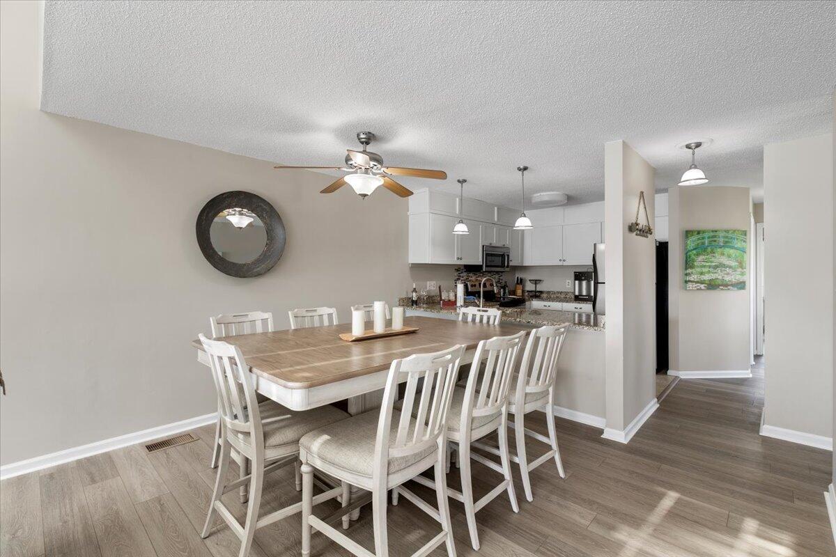 1206 Nature Lane Union Hall, VA 24176 - Photo 26 of 106 a view of a dining room with furniture and wooden floor