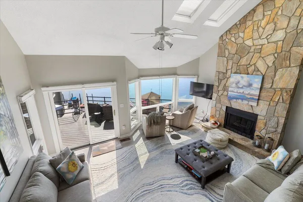 a view of a house with backyard porch and sitting area