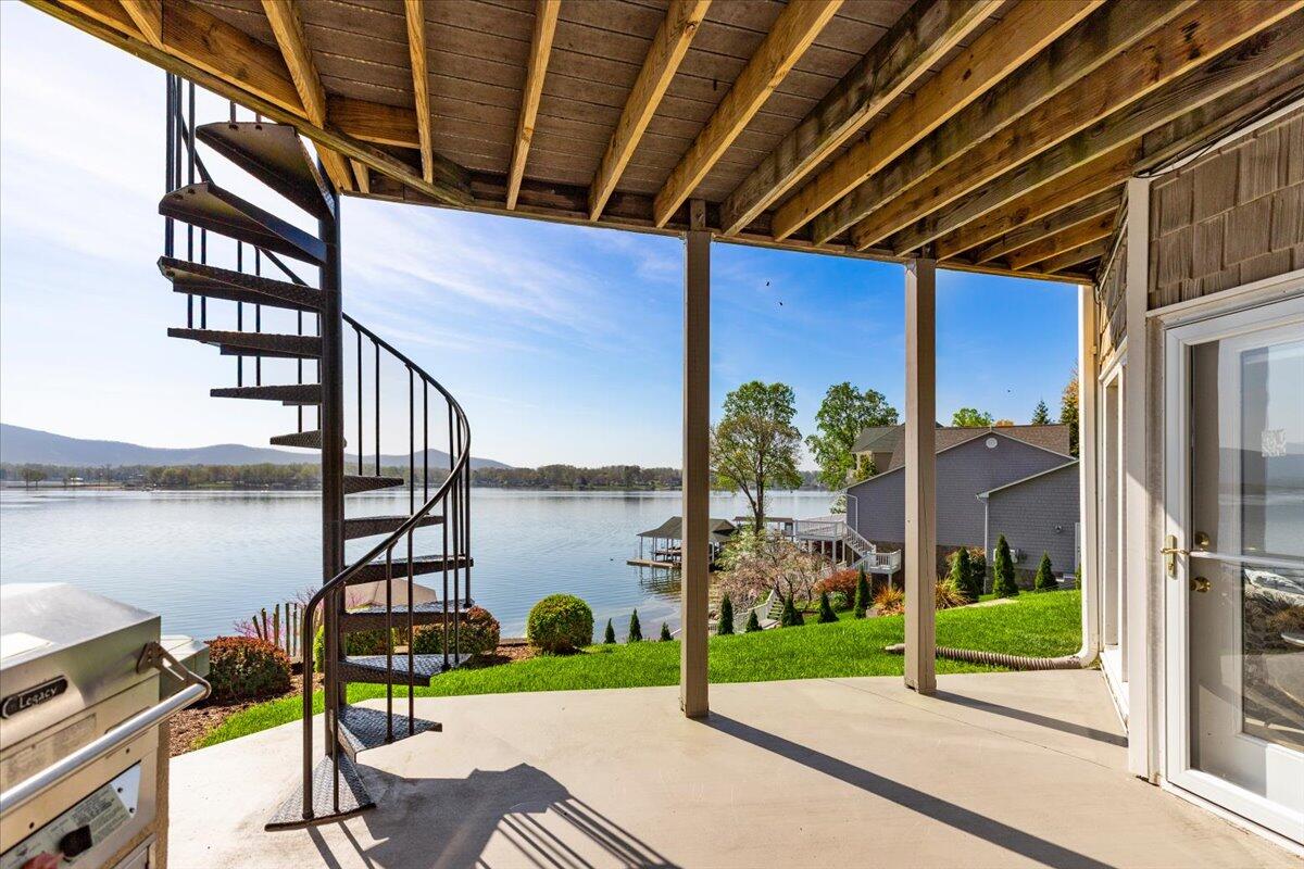 1206 Nature Lane Union Hall, VA 24176 - Photo 53 of 106 a view of a porch with chairs and floor to ceiling window
