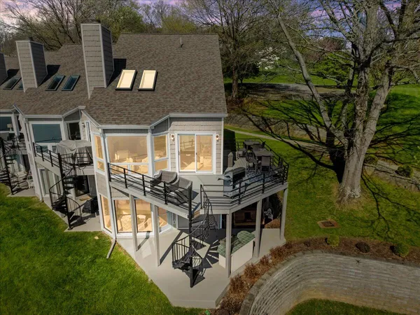 a bedroom with a bed and a view of balcony
