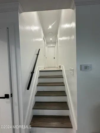 a en suite bathroom with toilet sink and mirror