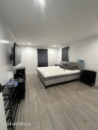 a bathroom with a sink mirror and shower