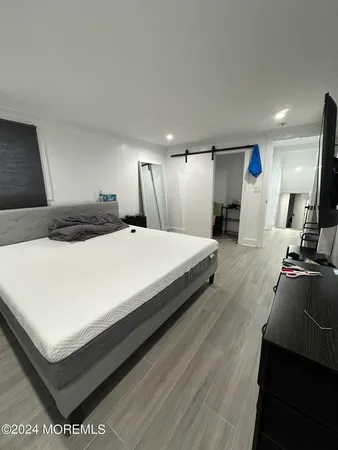 a view of hallway with wooden floor