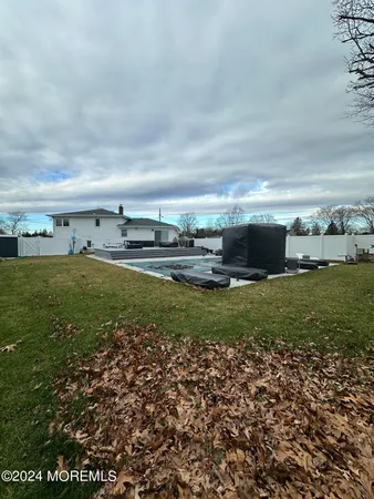 a kitchen with stainless steel appliances kitchen island granite countertop a sink and cabinets