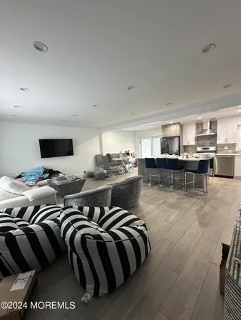 a kitchen with a sink a counter top space and stainless steel appliances