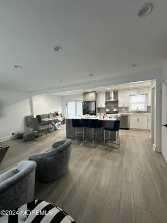 a room with a bed and a dresser