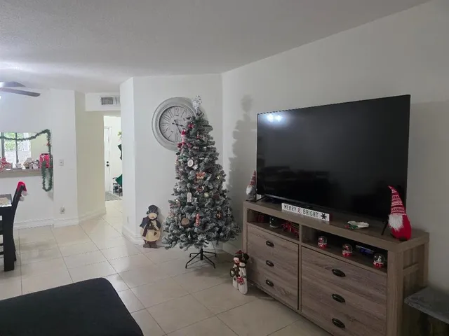 a room with furniture and a flat screen tv