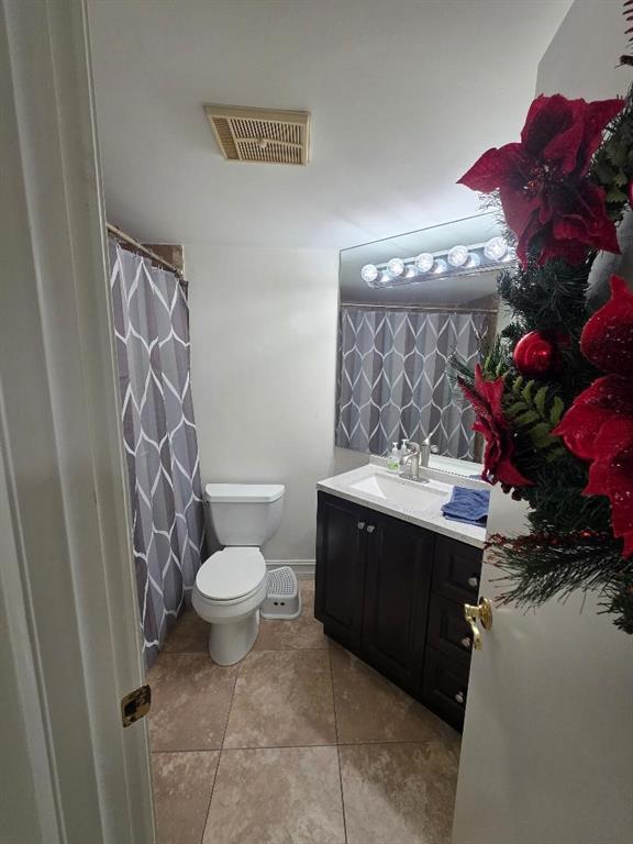 5583 Courtyard Drive, Unit 5583 Margate, FL 33063 - Photo 3 of 12 a bathroom with a sink toilet and shower