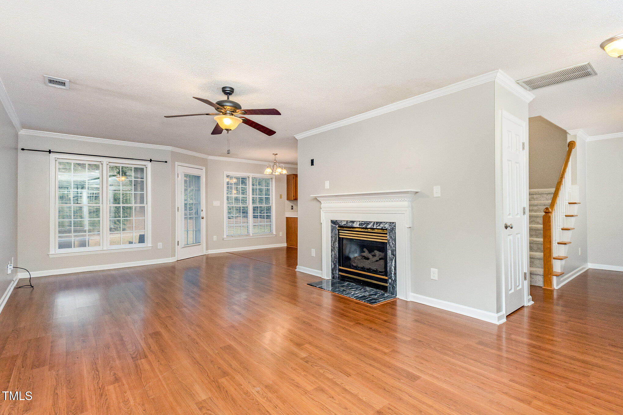 109 Gatepost Lane Cary, NC 27513 - Photo 11 of 37 a view of empty room with wooden floor and fireplace