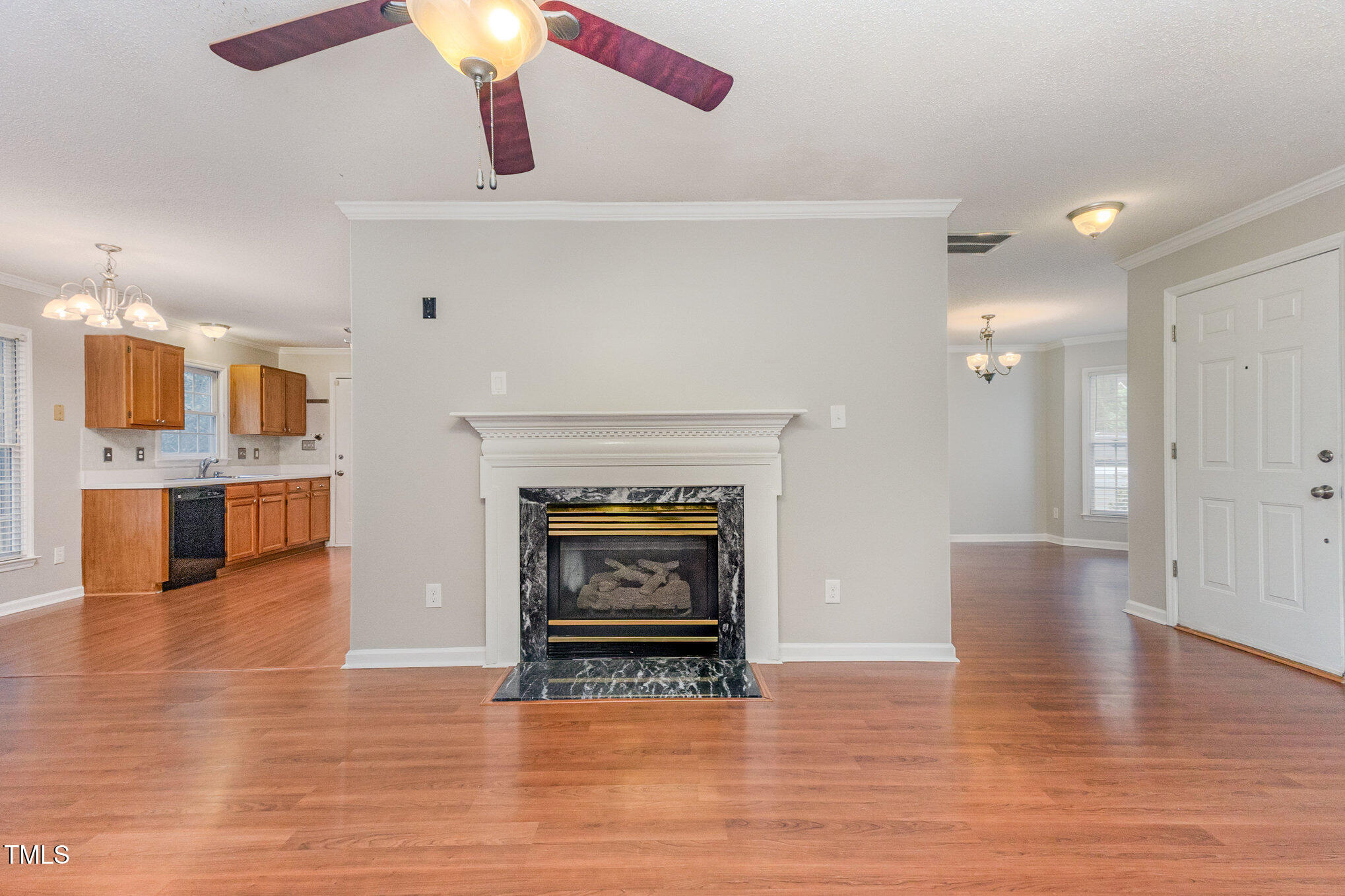 109 Gatepost Lane Cary, NC 27513 - Photo 13 of 37 a view of an empty room with a fireplace and wooden floor