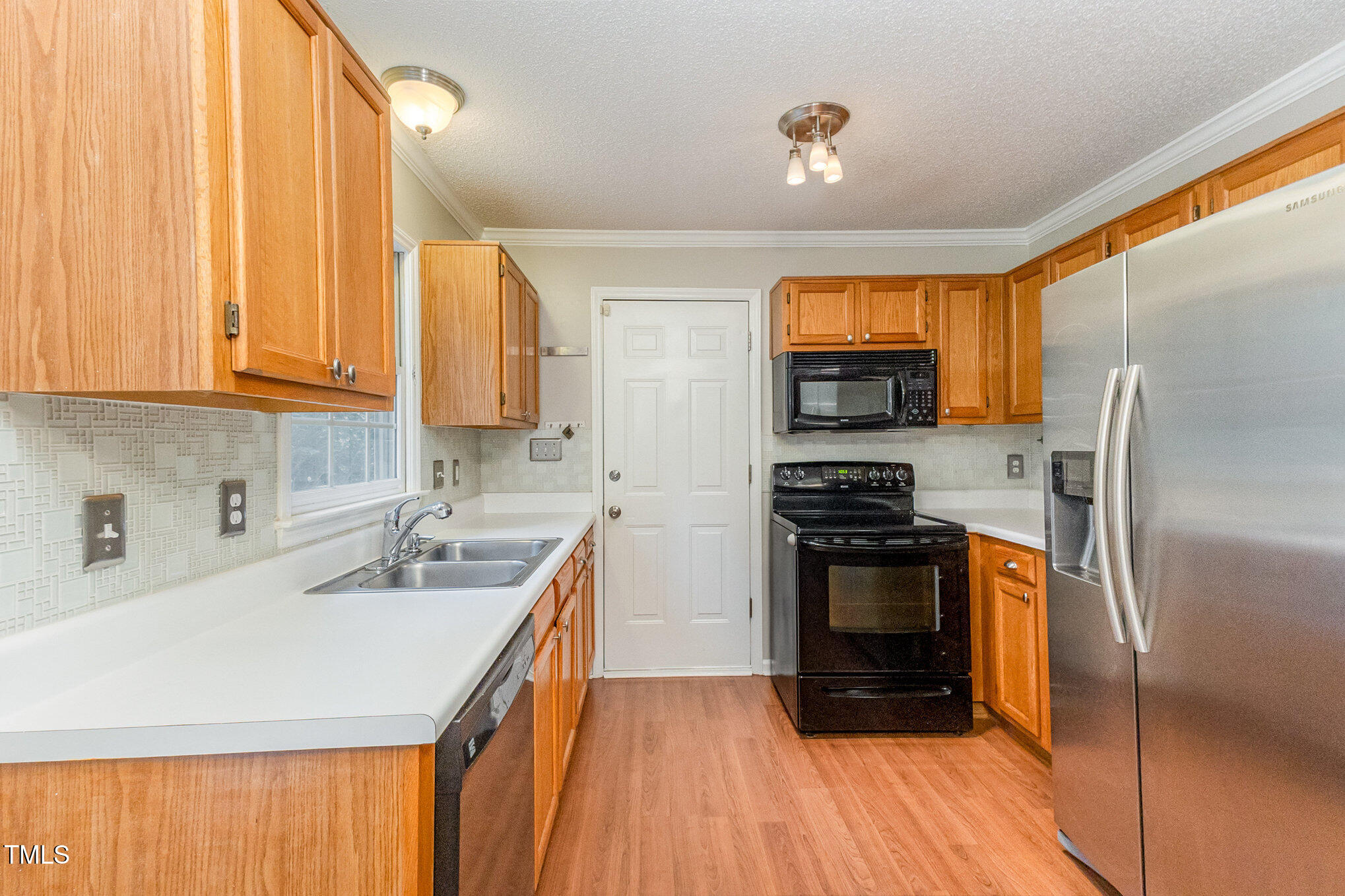 109 Gatepost Lane Cary, NC 27513 - Photo 15 of 37 a kitchen with a sink stove and refrigerator