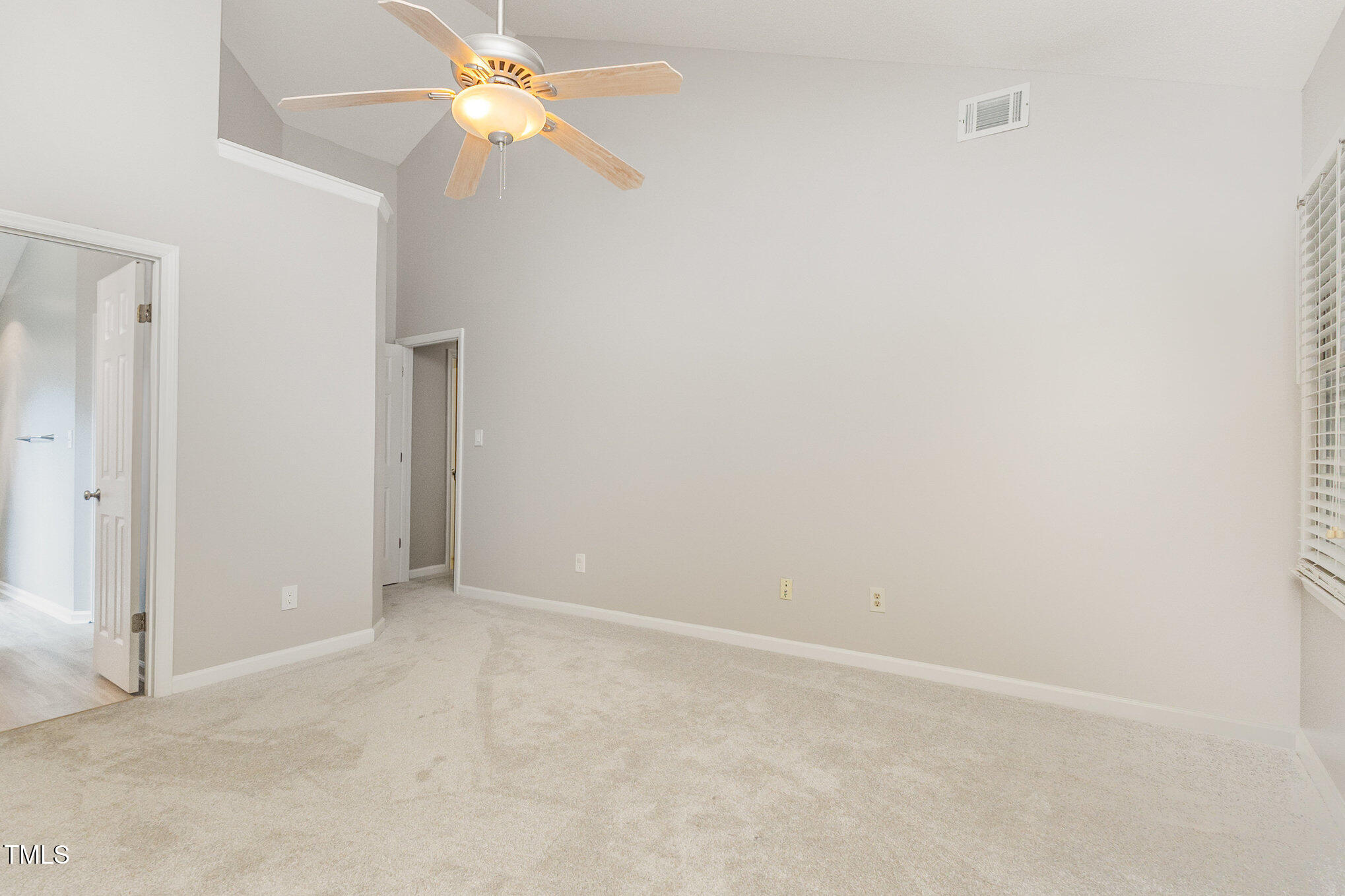 109 Gatepost Lane Cary, NC 27513 - Photo 17 of 37 a view of an empty room with a fan
