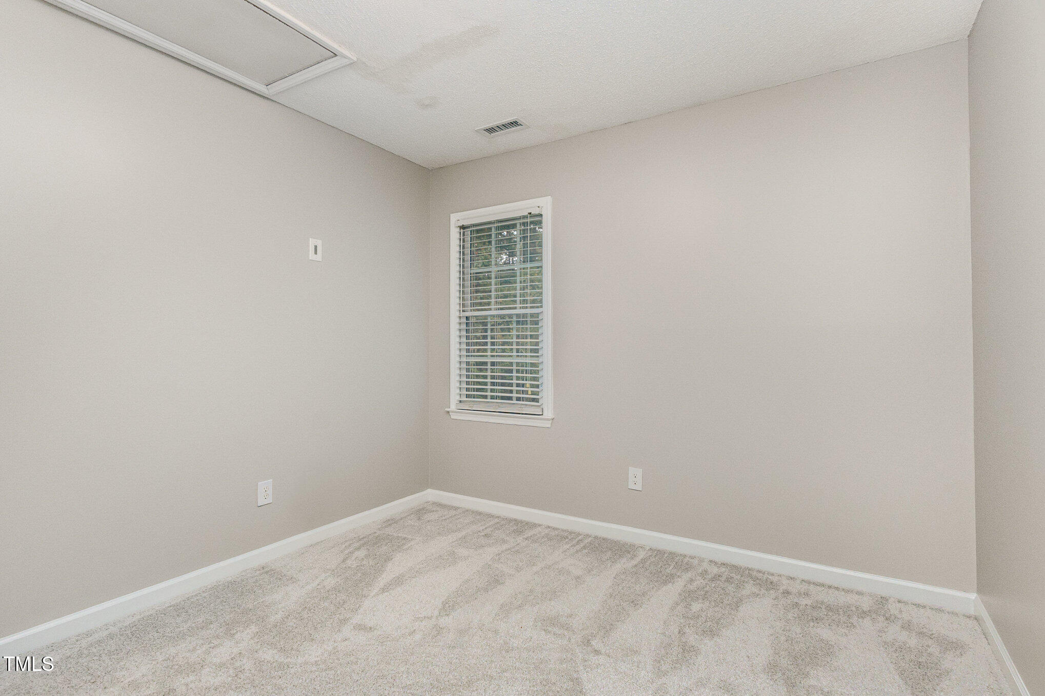 109 Gatepost Lane Cary, NC 27513 - Photo 27 of 37 an empty room with a window