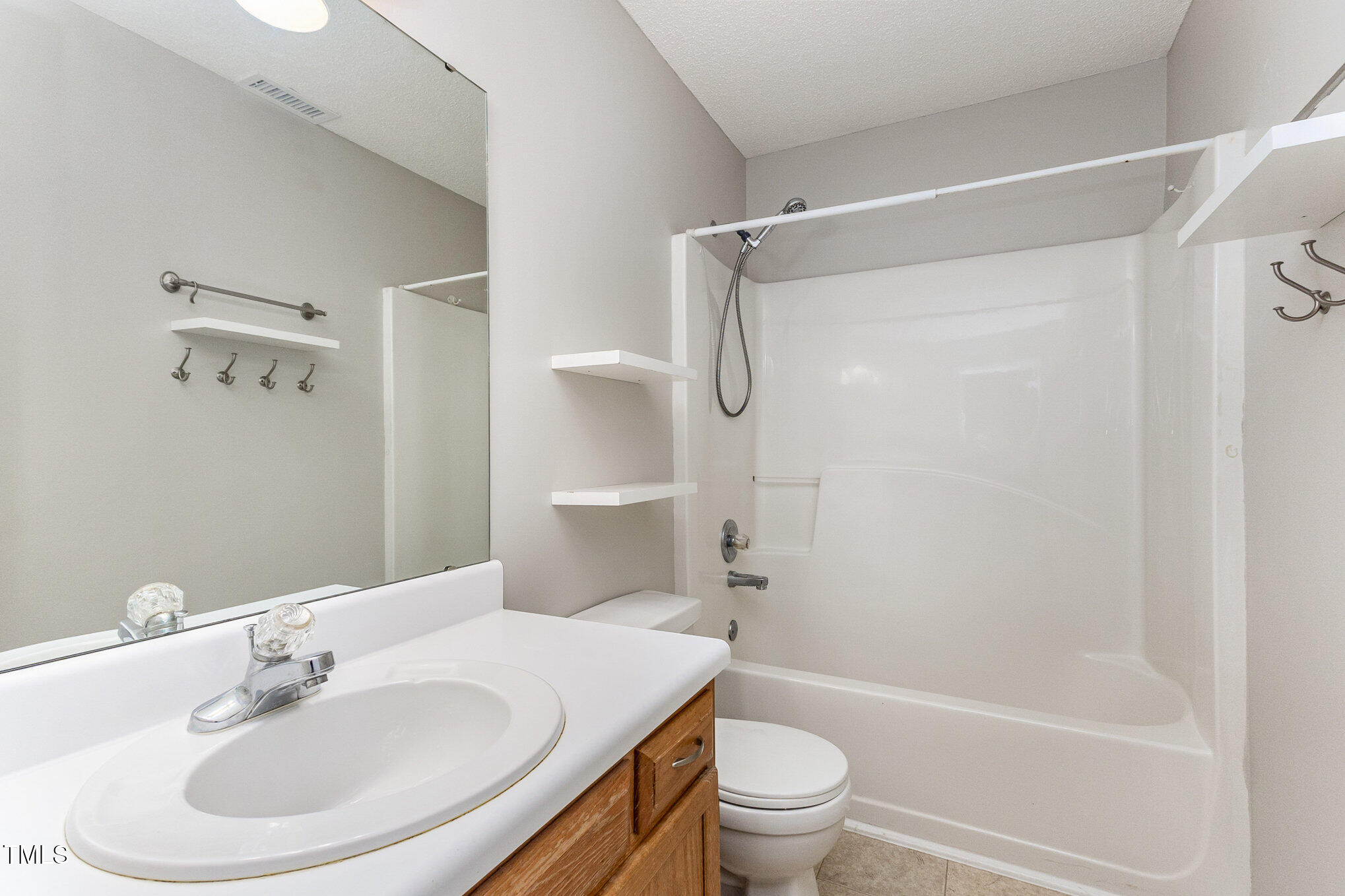 109 Gatepost Lane Cary, NC 27513 - Photo 29 of 37 a bathroom with a sink toilet and shower