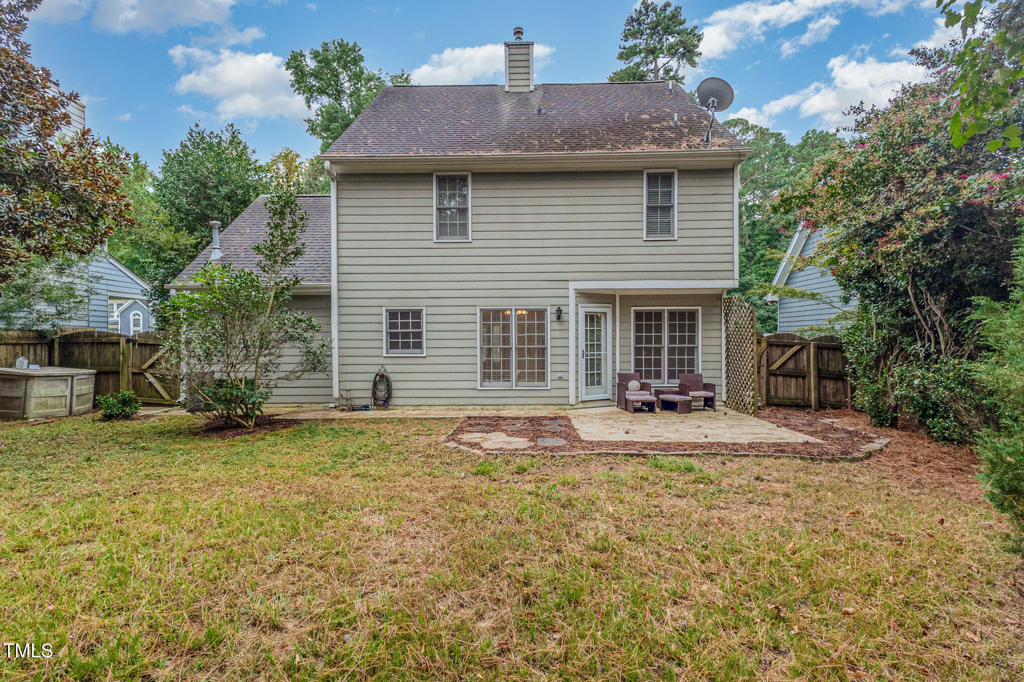 109 Gatepost Lane Cary, NC 27513 - Photo 32 of 37 a front view of a house with a garden and yard