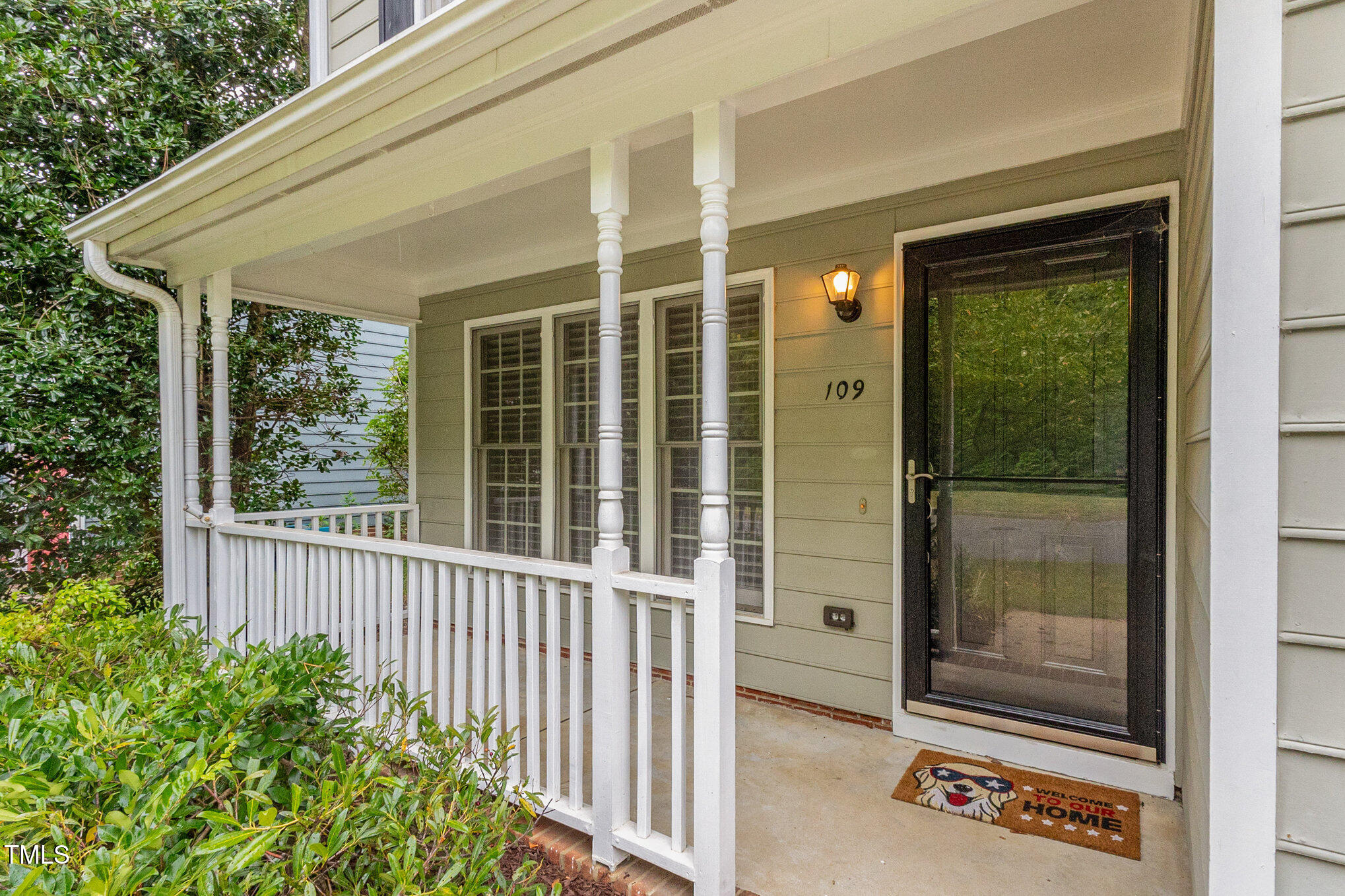 109 Gatepost Lane Cary, NC 27513 - Photo 35 of 37 a view of a porch with a table and chairs