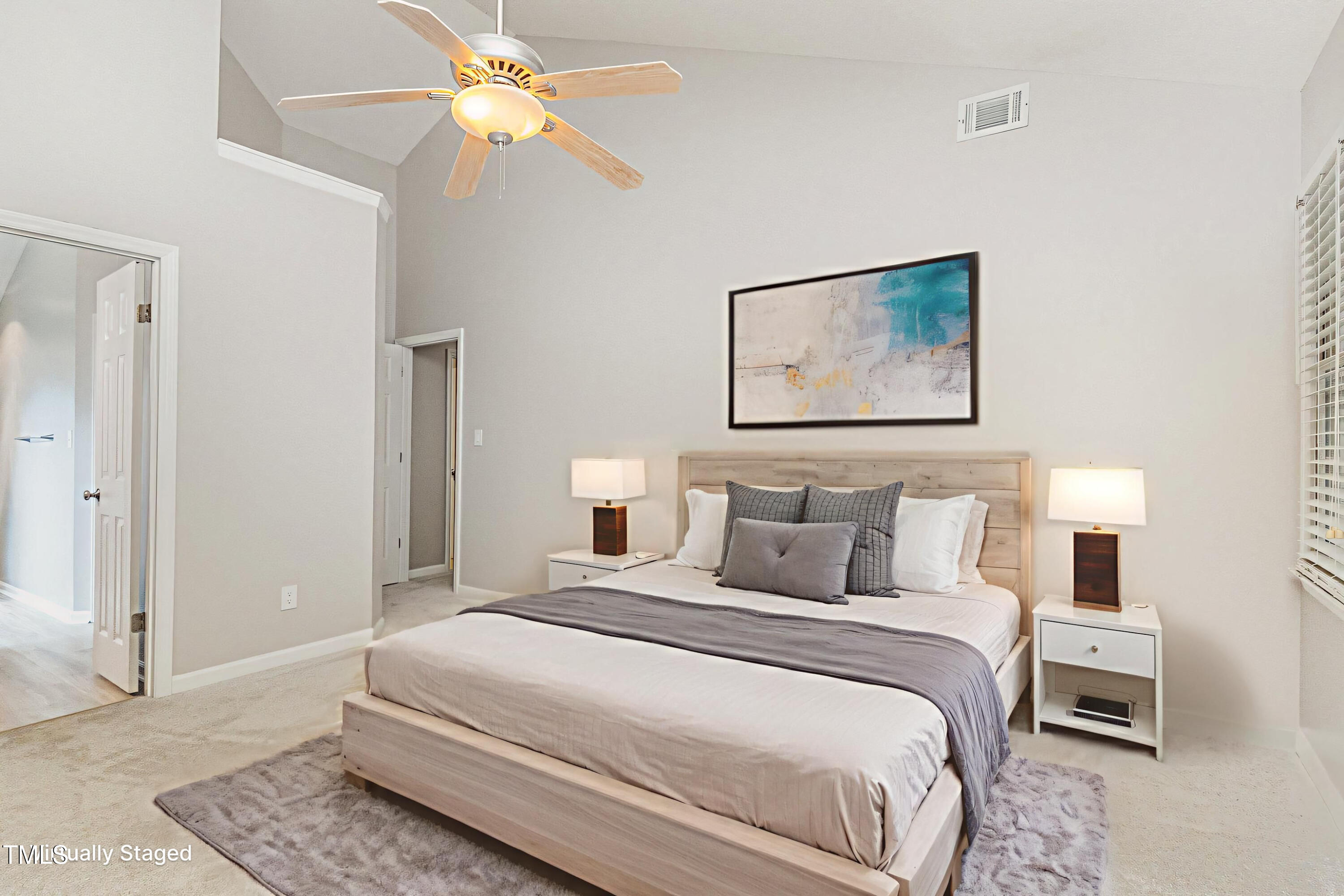 109 Gatepost Lane Cary, NC 27513 - Photo 7 of 37 a bedroom with a bed and a chandelier