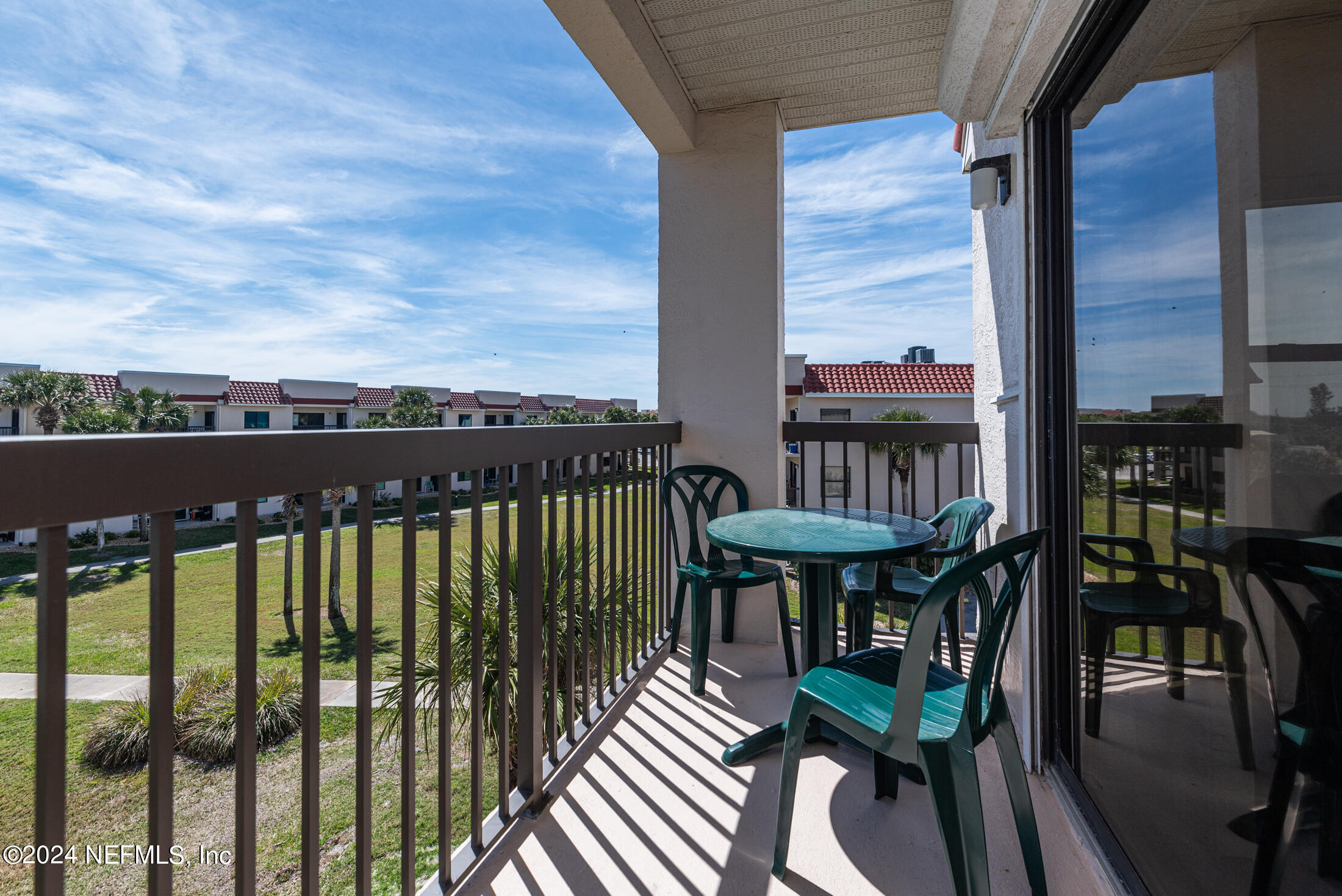 4250 A1A South, Unit Q31 (ELEVATOR) St. Augustine, FL 32080 - Photo 14 of 45 a view of a balcony with chairs and wooden floor
