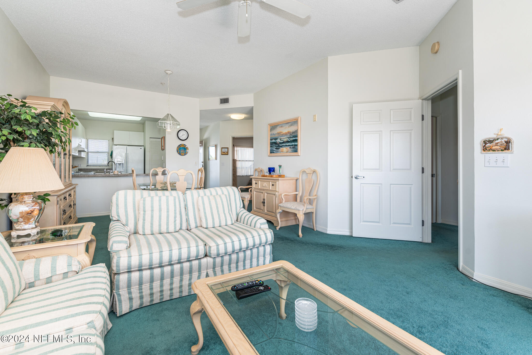 4250 A1A South, Unit Q31 (ELEVATOR) St. Augustine, FL 32080 - Photo 17 of 45 a bedroom with a bed and a chair