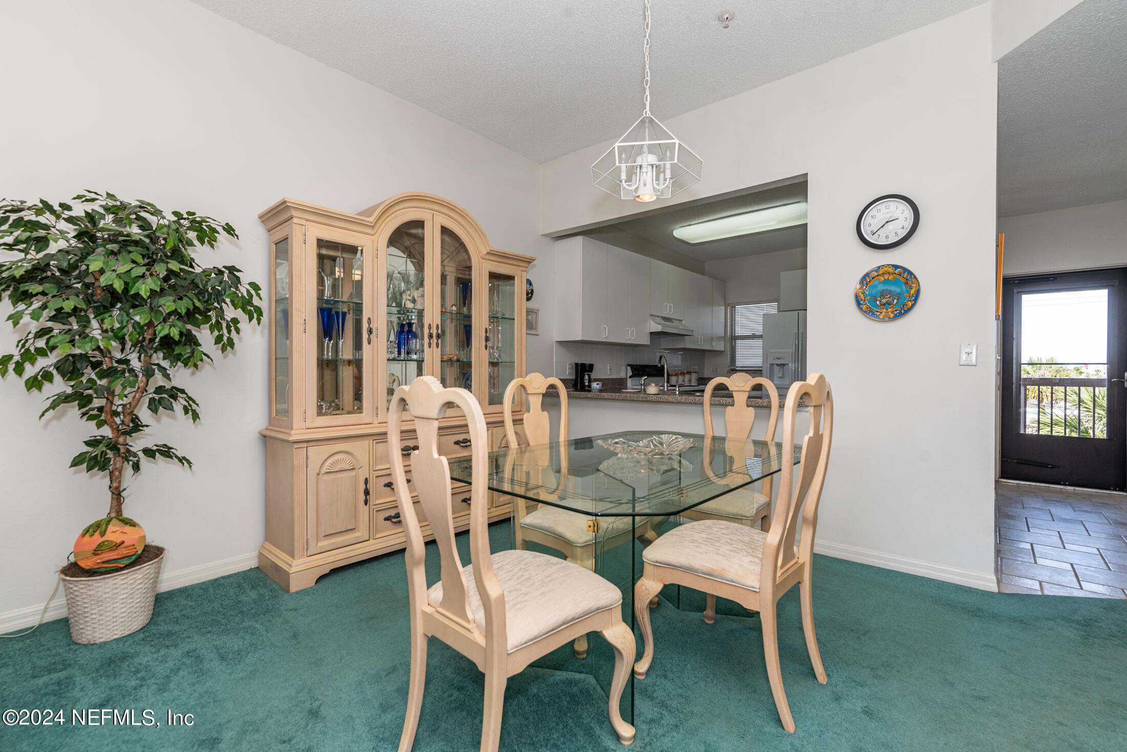 4250 A1A South, Unit Q31 (ELEVATOR) St. Augustine, FL 32080 - Photo 18 of 45 a view of a dining room with furniture and chandelier