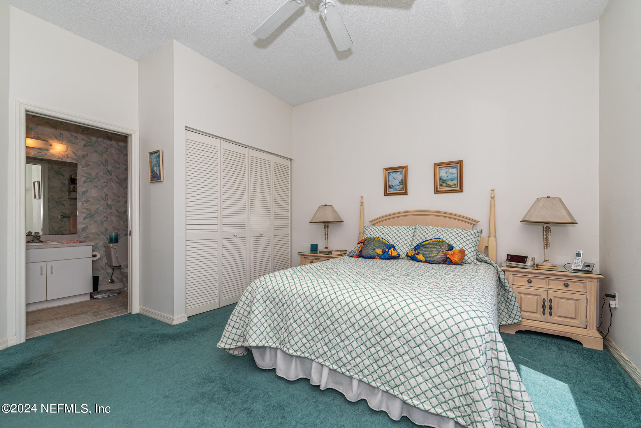 4250 A1A South, Unit Q31 (ELEVATOR) St. Augustine, FL 32080 - Photo 21 of 45 a bedroom with a bed and a view of kitchen