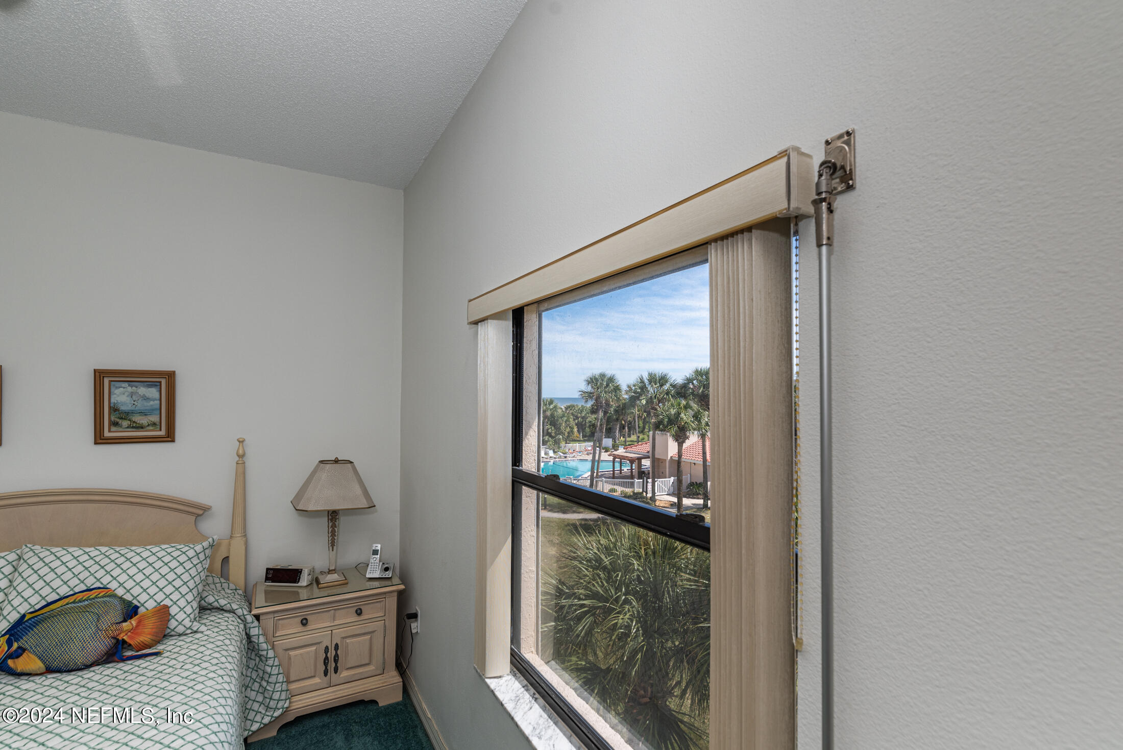 4250 A1A South, Unit Q31 (ELEVATOR) St. Augustine, FL 32080 - Photo 22 of 45 a bedroom with furniture and a gate