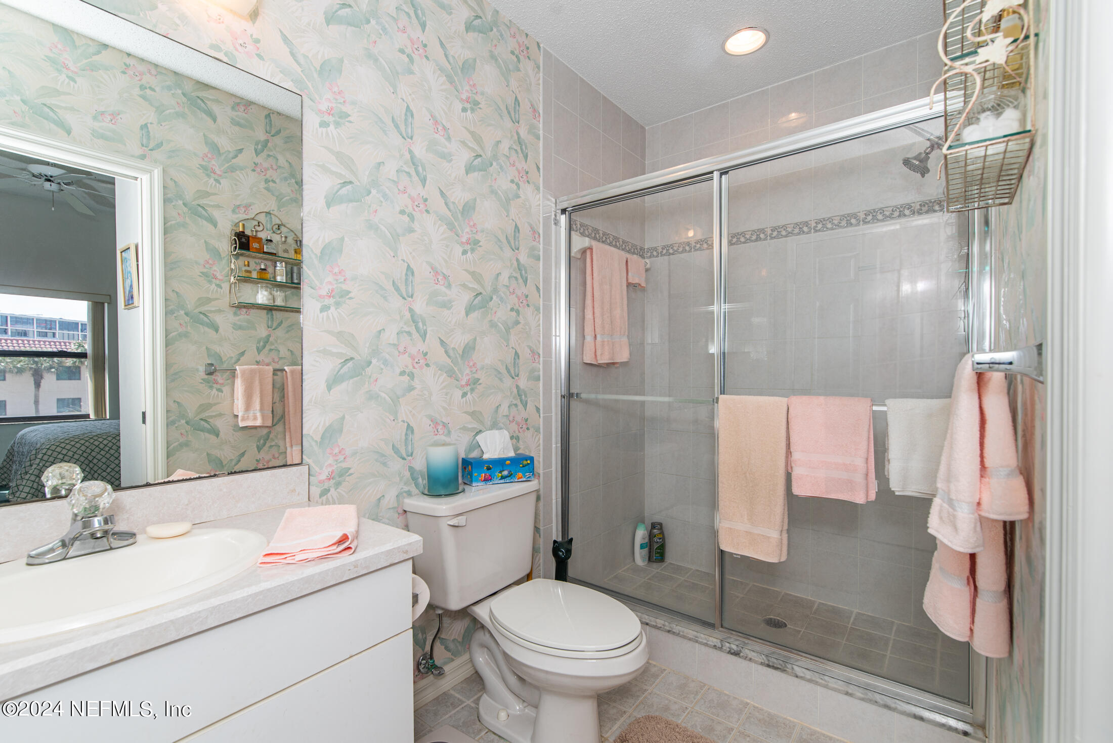 4250 A1A South, Unit Q31 (ELEVATOR) St. Augustine, FL 32080 - Photo 24 of 45 a bathroom with a sink toilet vanity and shower