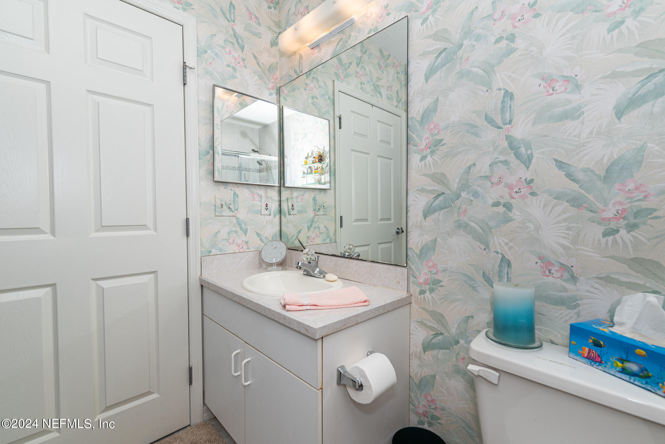 4250 A1A South, Unit Q31 (ELEVATOR) St. Augustine, FL 32080 - Photo 25 of 45 a bathroom with a sink and a mirror