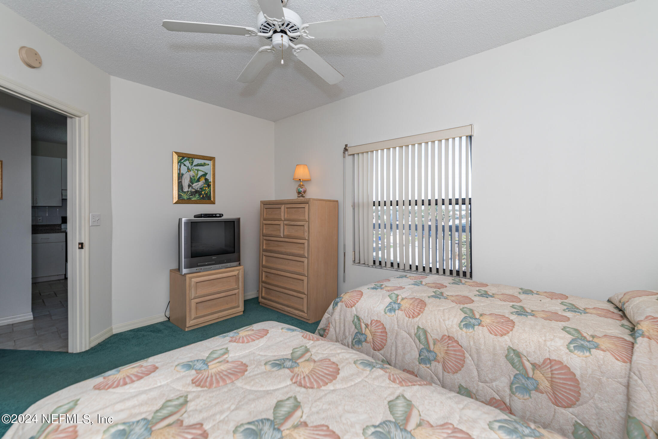 4250 A1A South, Unit Q31 (ELEVATOR) St. Augustine, FL 32080 - Photo 29 of 45 a bedroom with a bed and a window