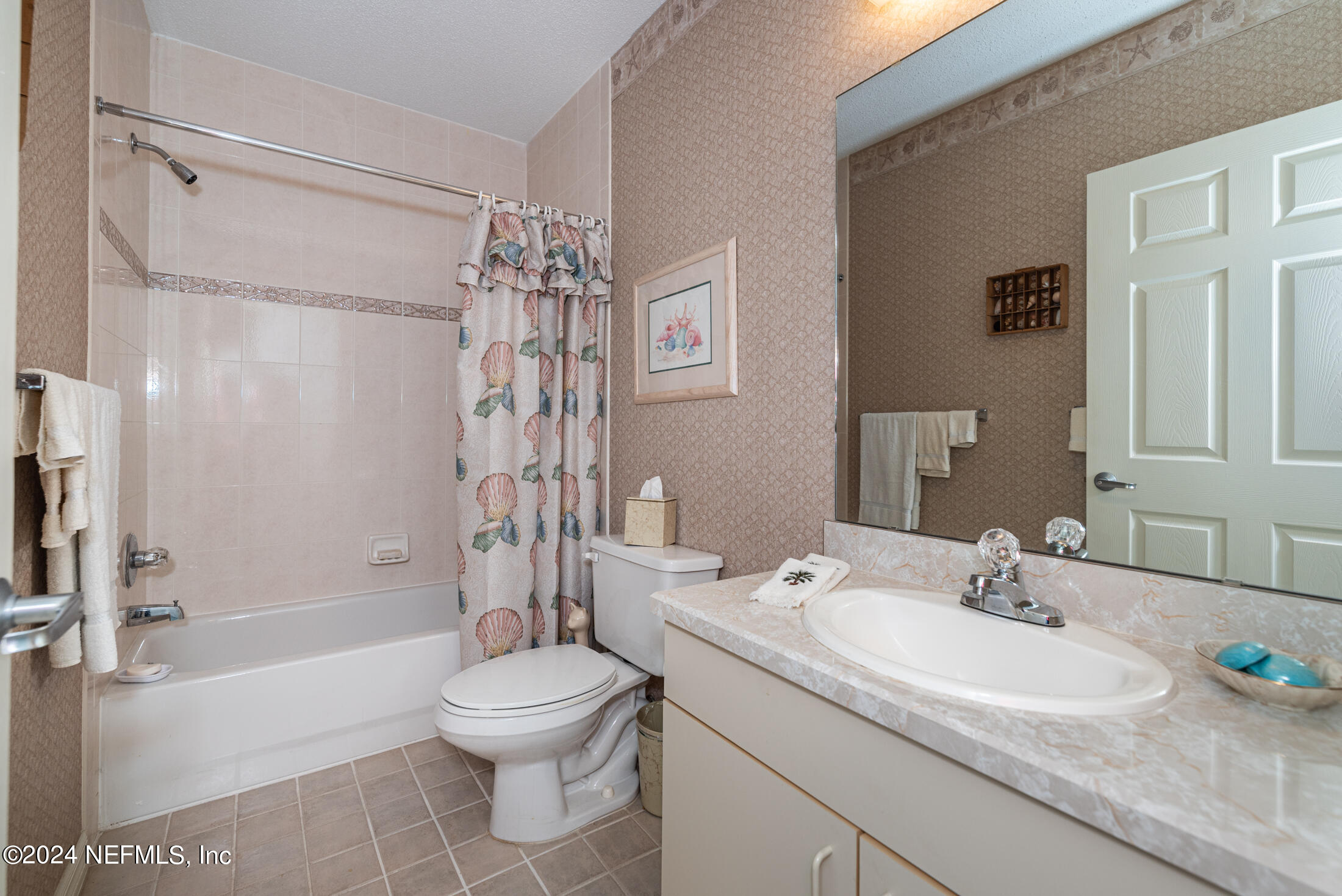 4250 A1A South, Unit Q31 (ELEVATOR) St. Augustine, FL 32080 - Photo 30 of 45 a bathroom with a granite countertop sink toilet a shower and a mirror