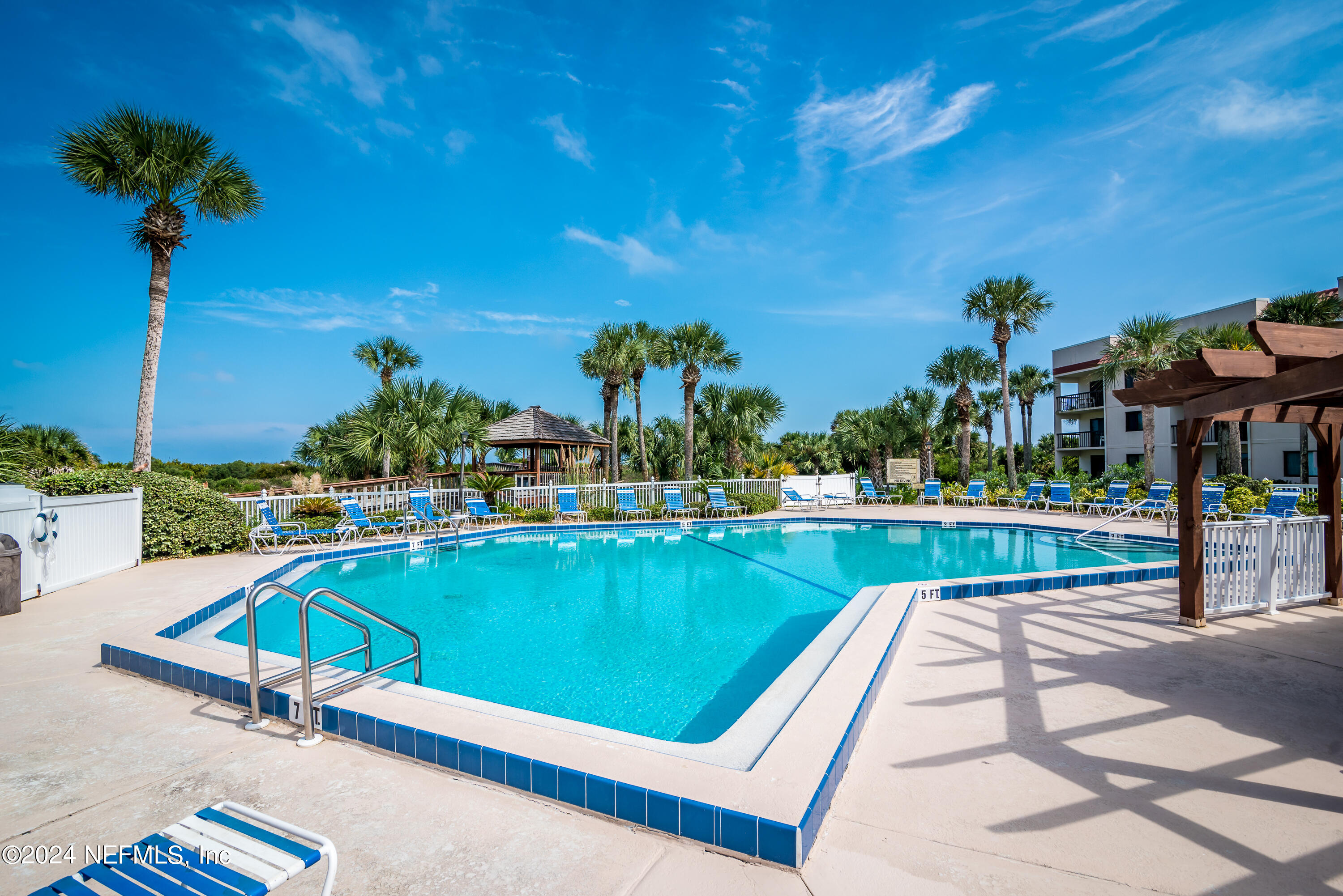 4250 A1A South, Unit Q31 (ELEVATOR) St. Augustine, FL 32080 - Photo 45 of 45 a swimming pool with outdoor seating and yard