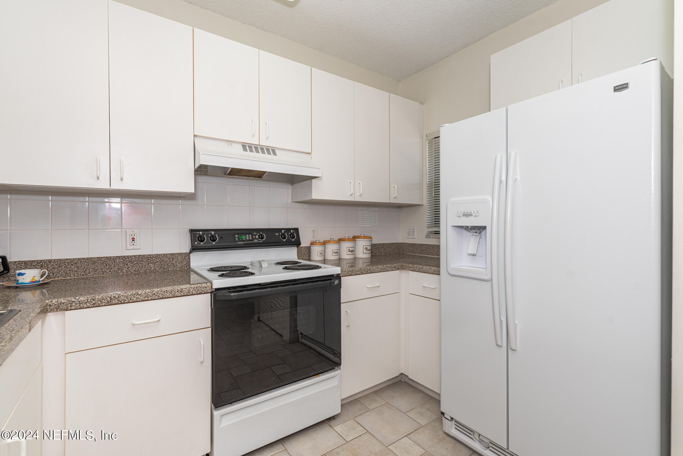 4250 A1A South, Unit Q31 (ELEVATOR) St. Augustine, FL 32080 - Photo 6 of 45 a kitchen with cabinets and appliances