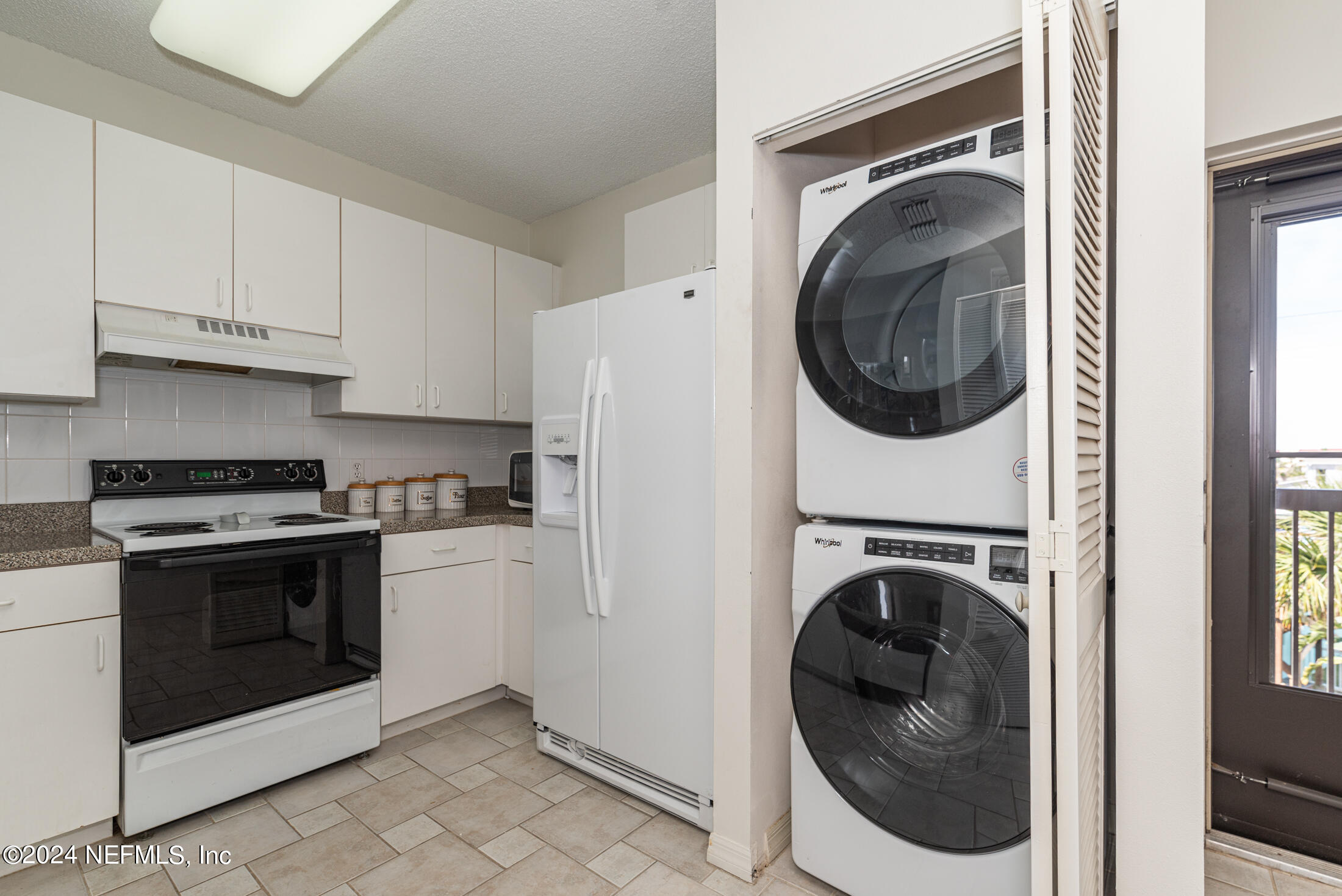 4250 A1A South, Unit Q31 (ELEVATOR) St. Augustine, FL 32080 - Photo 8 of 45 a kitchen with a washer and dryer in it