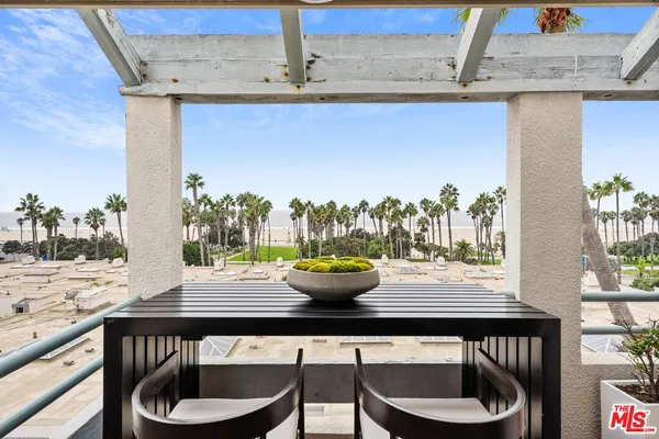 a dining room with a table and chairs