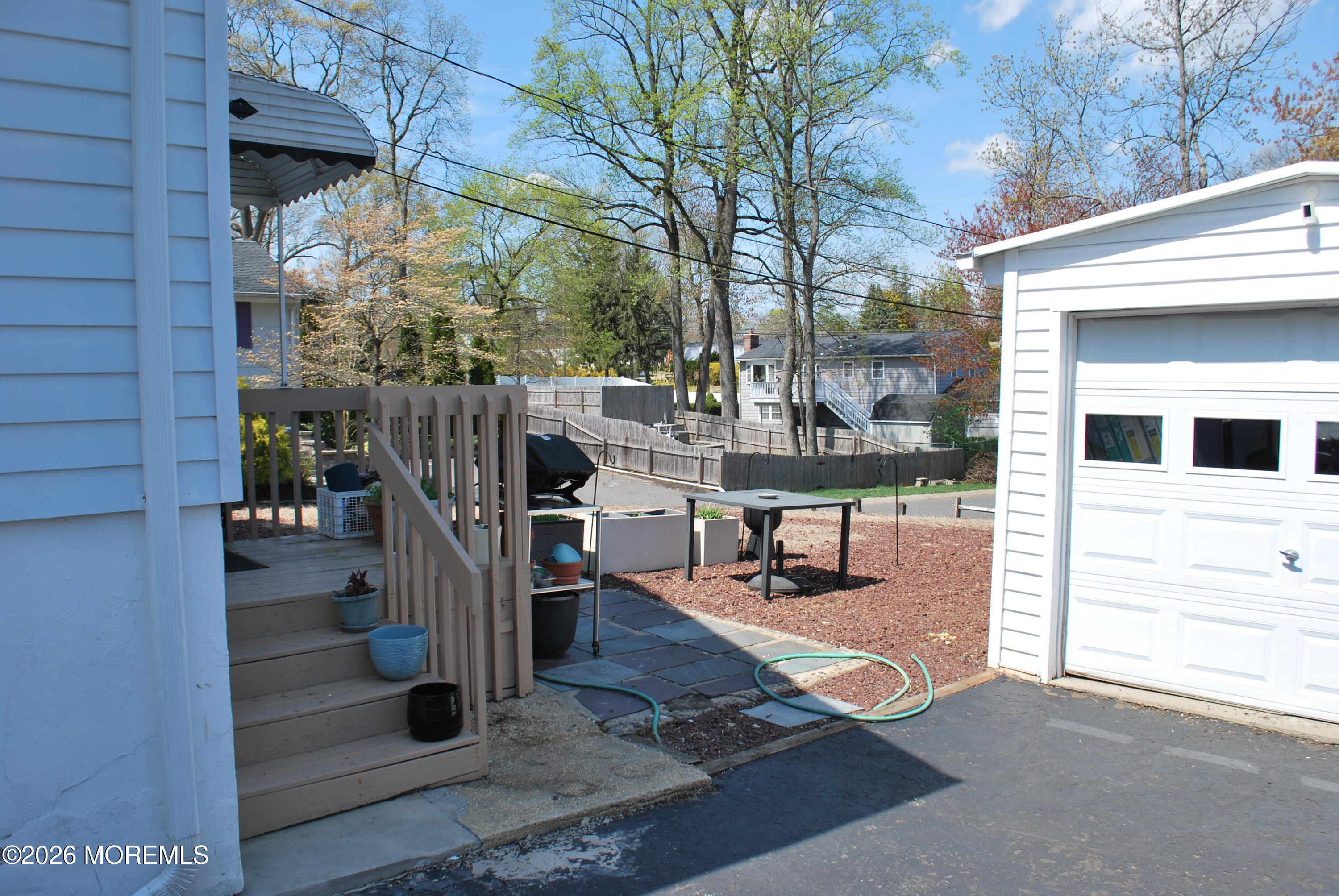 7 Houston Street Red Bank, NJ 07701 - Photo 11 of 38 a view of a patio with table and chairs with wooden floor and fence