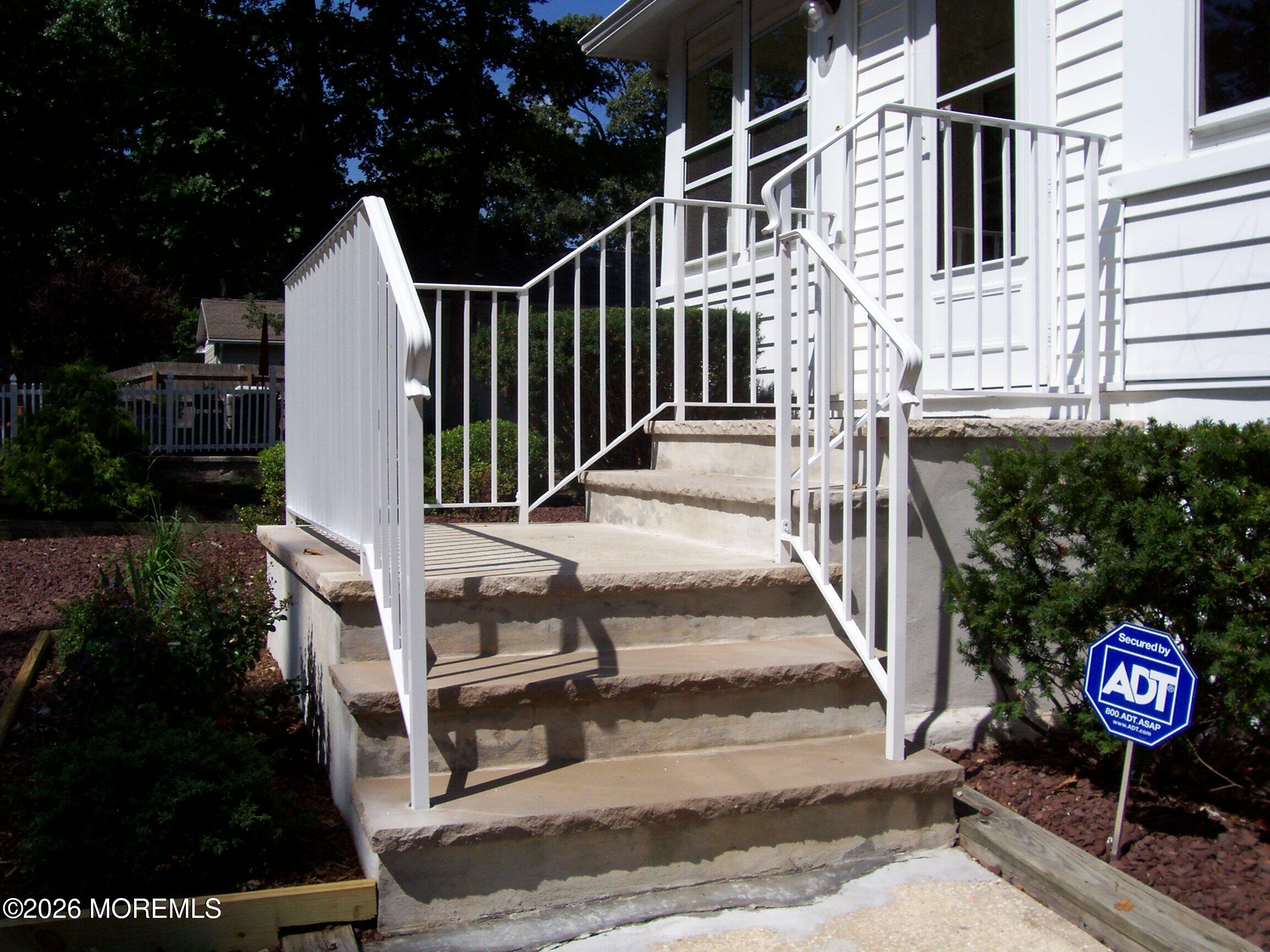 7 Houston Street Red Bank, NJ 07701 - Photo 2 of 38 a view of a entrance gate of the house and tree