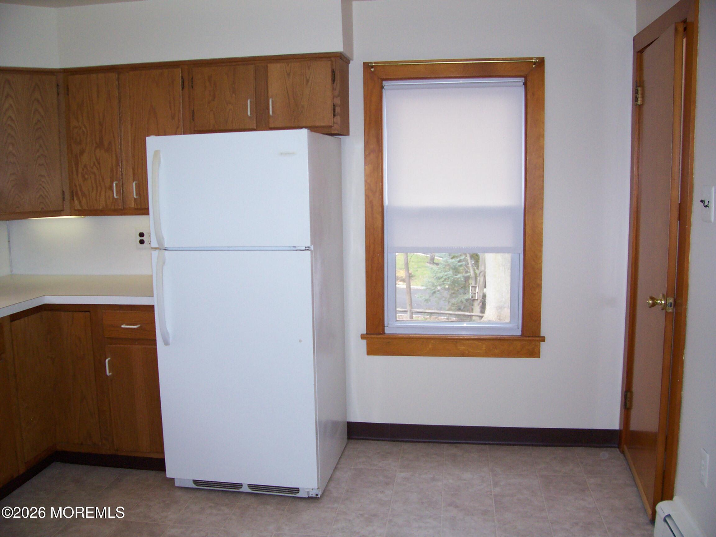 7 Houston Street Red Bank, NJ 07701 - Photo 30 of 38 a white refrigerator freezer sitting in a kitchen