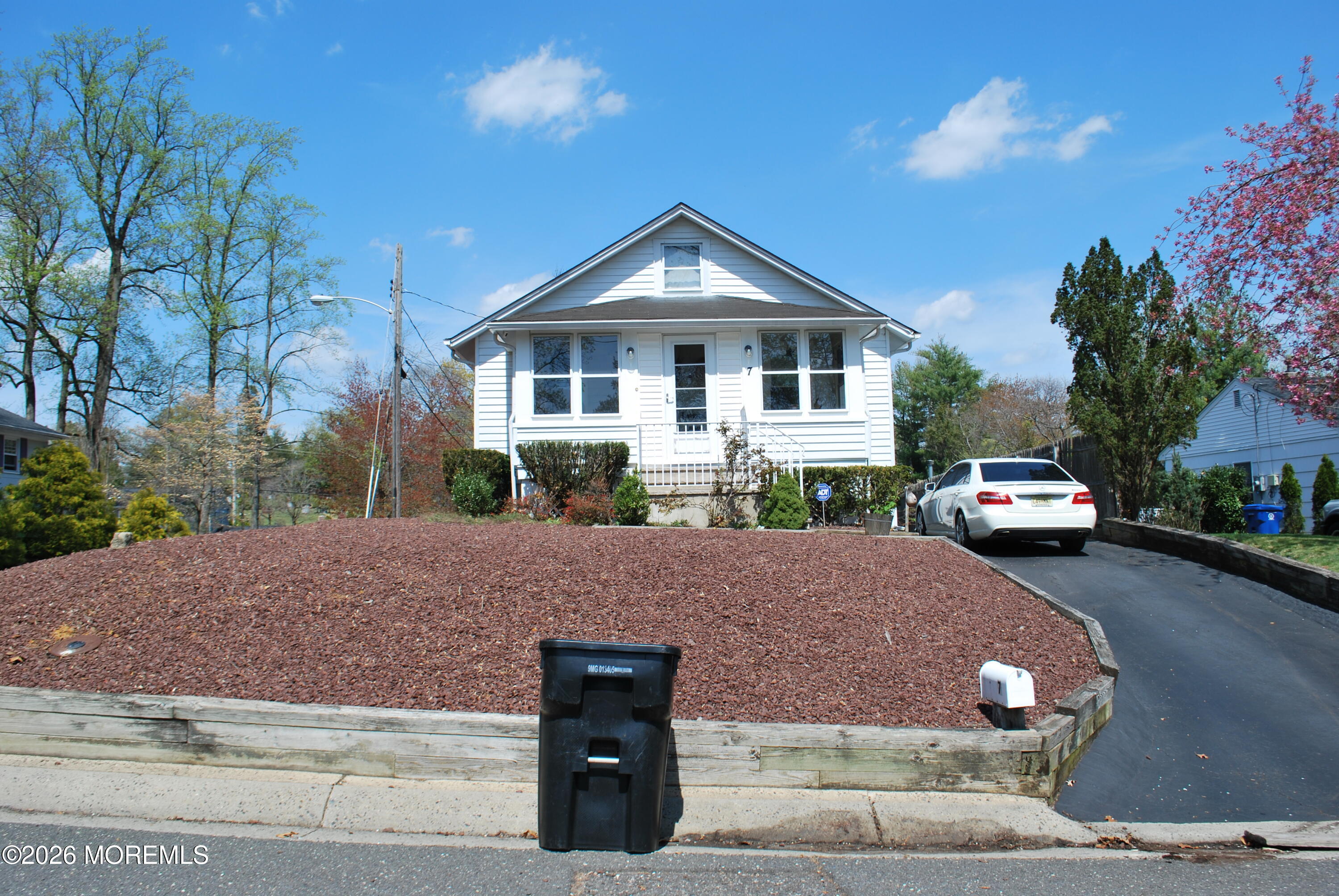 7 Houston Street Red Bank, NJ 07701 - Photo 3 of 38 a front view of a house with a yard and garage