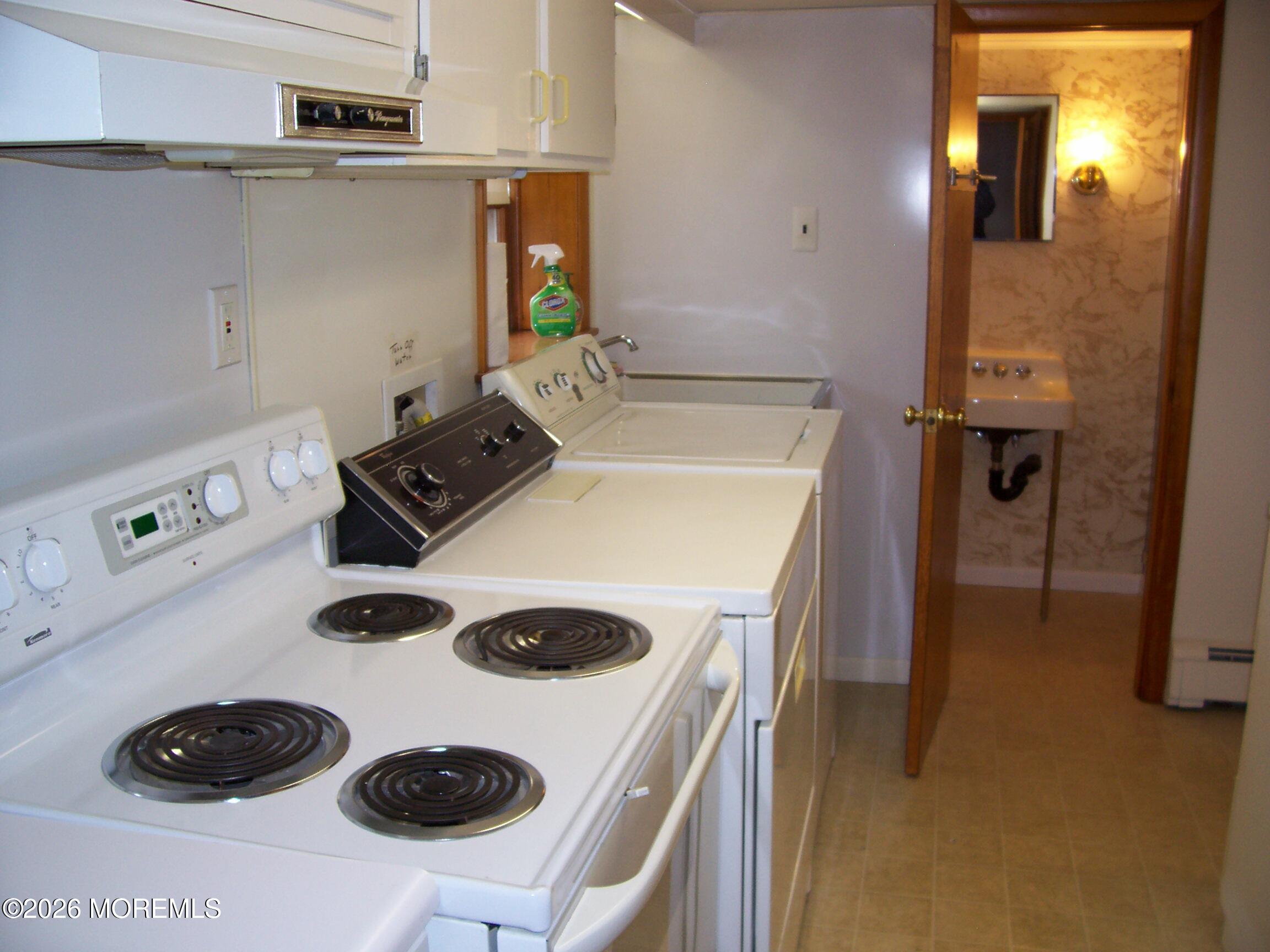 7 Houston Street Red Bank, NJ 07701 - Photo 34 of 38 a kitchen with a stove and a refrigerator