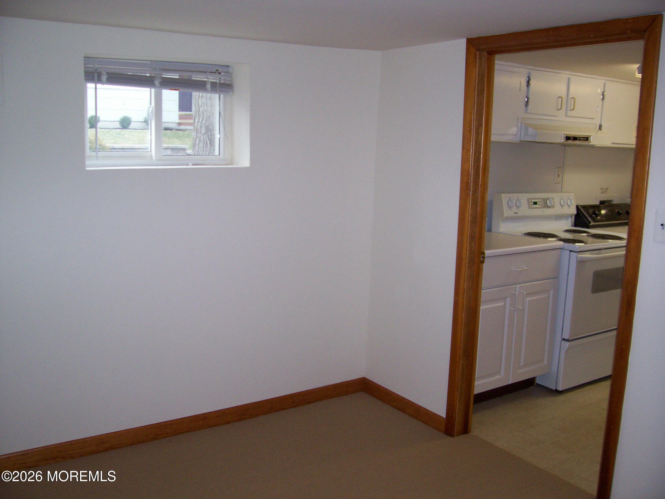 7 Houston Street Red Bank, NJ 07701 - Photo 37 of 38 a room with a stove and a cabinet