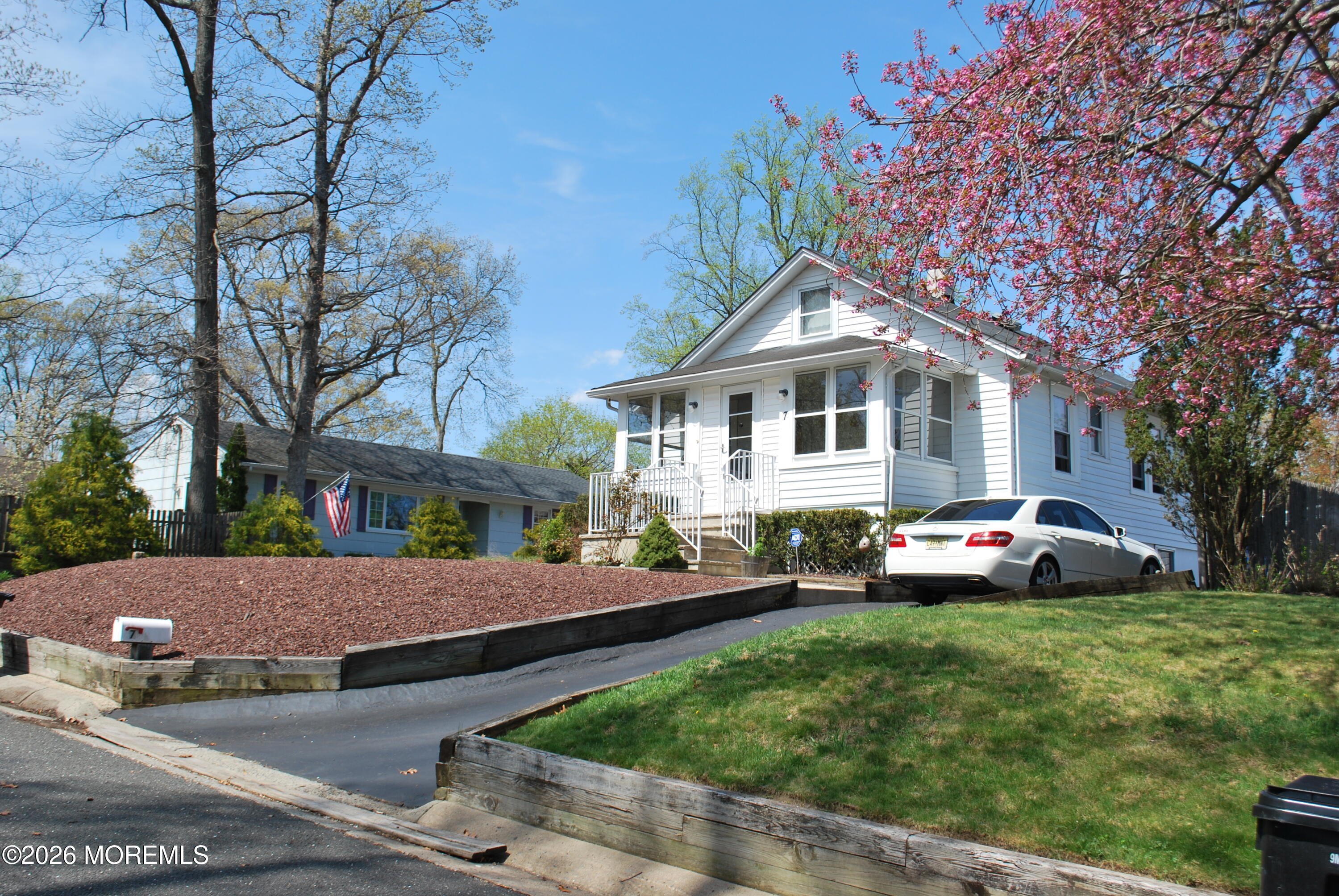 7 Houston Street Red Bank, NJ 07701 - Photo 8 of 38 a front view of a house with a garden and trees