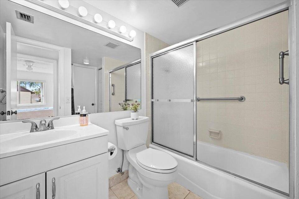 436 Pine Glen Lane, Unit B2 Greenacres, FL 33463 - Photo 9 of 19 a bathroom with a sink toilet and shower