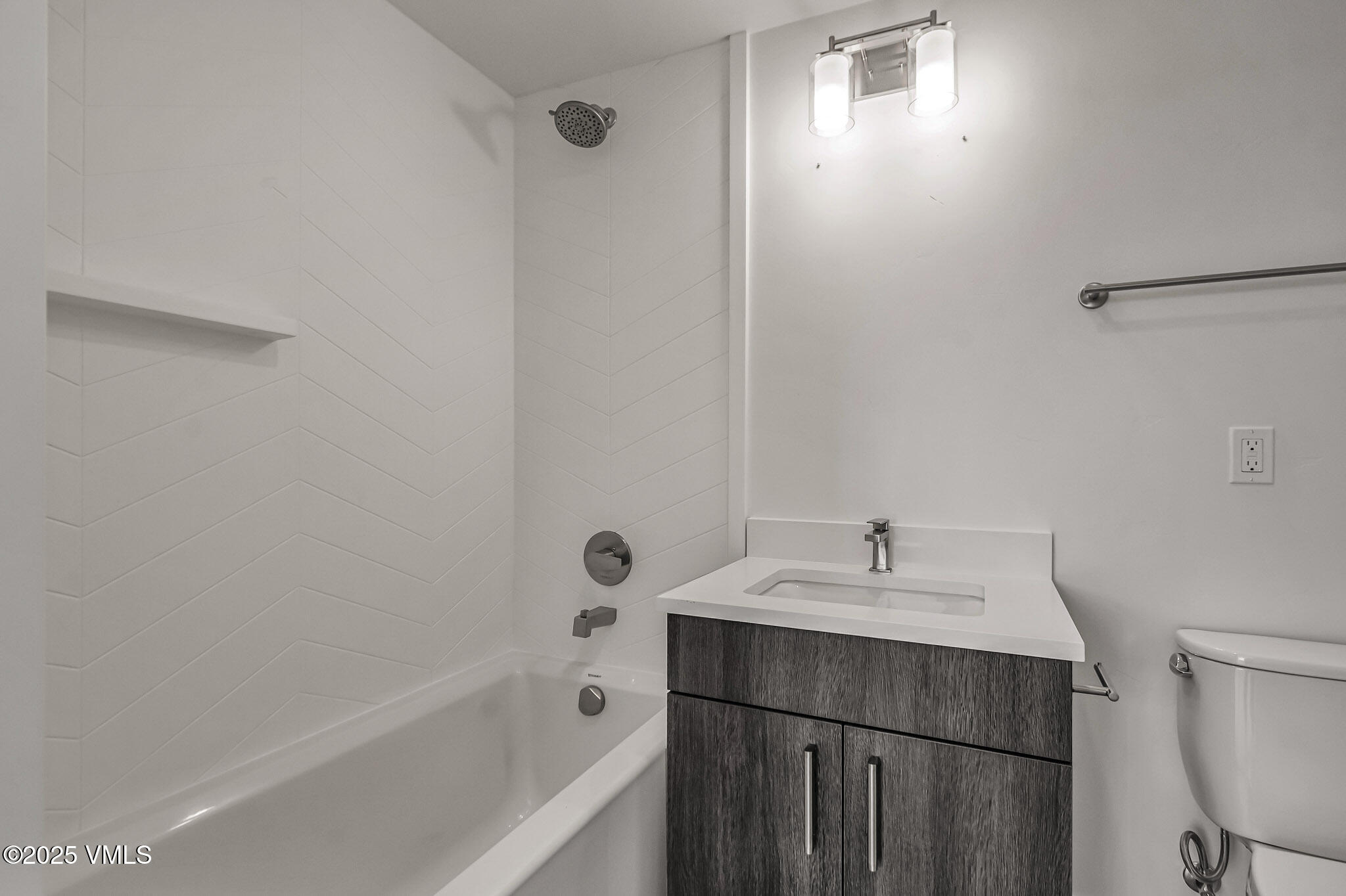 91 Mount Hope Circle, Unit C101 Eagle, CO 81631 - Photo 12 of 14 a bathroom with a sink a toilet and shower