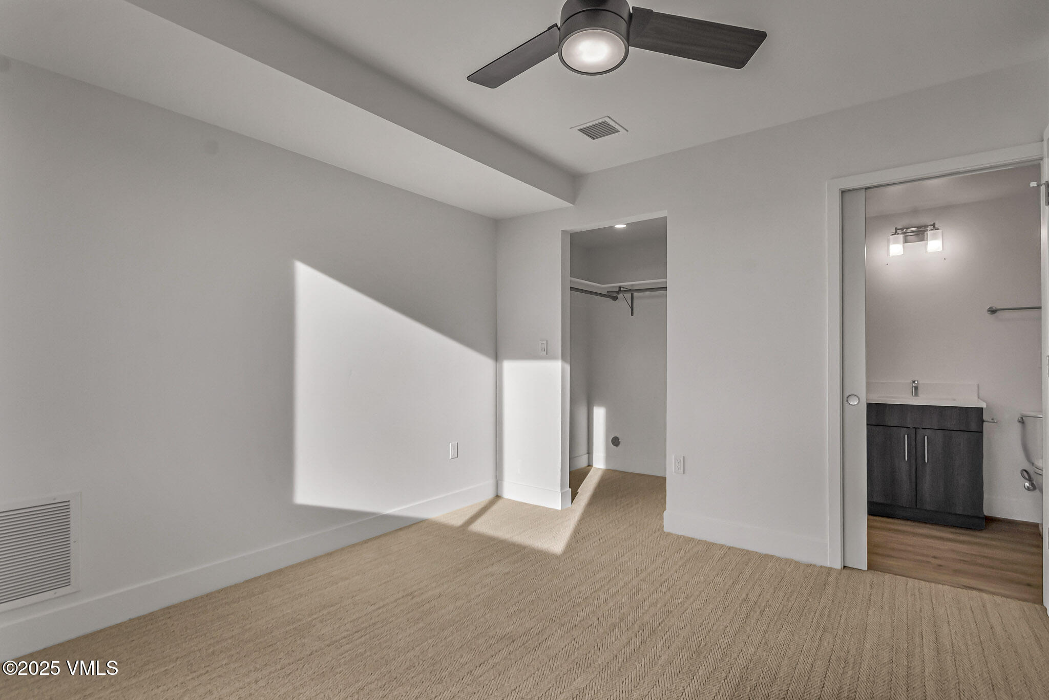 91 Mount Hope Circle, Unit C101 Eagle, CO 81631 - Photo 7 of 14 a view of an empty room and wooden floor
