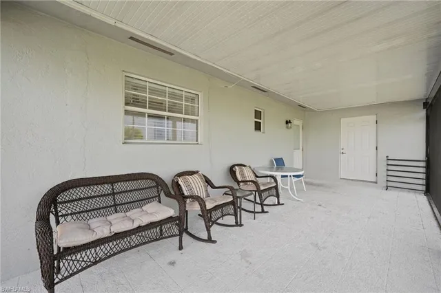 a view of swimming pool with furniture