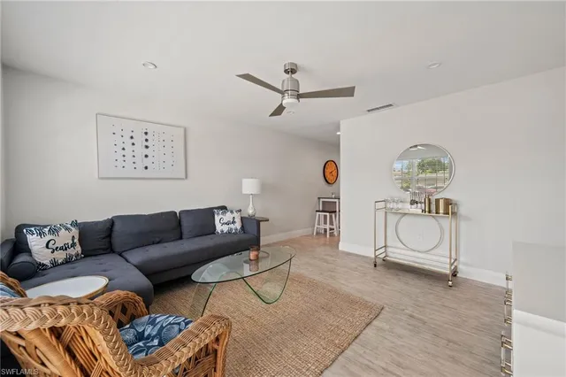 a living room with furniture and window