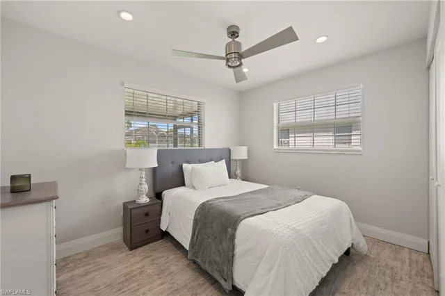 a bedroom with bed and a window