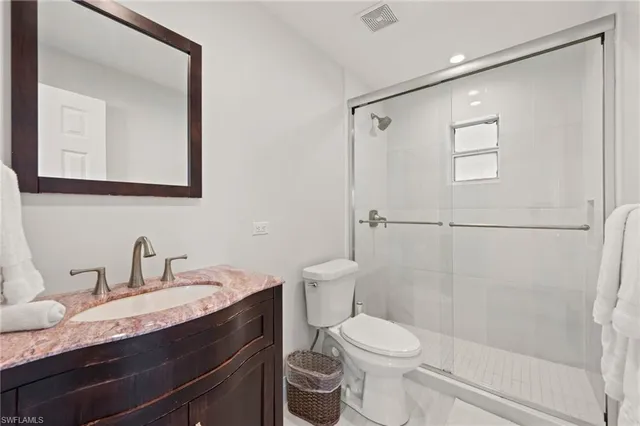 a view of a livingroom with furniture and white walls