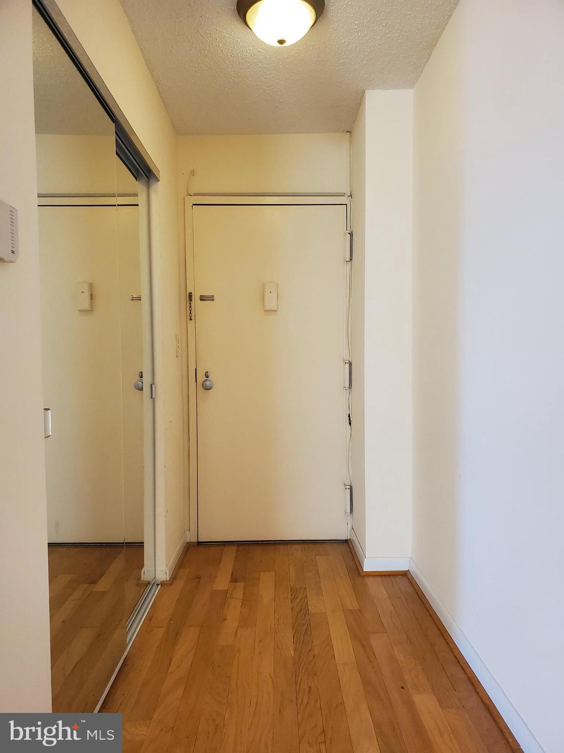 205 East Joppa Road, Unit 2105 Towson, MD 21286 - Photo 13 of 46 Mirrored Bi-fold Entrance Hallway Closet